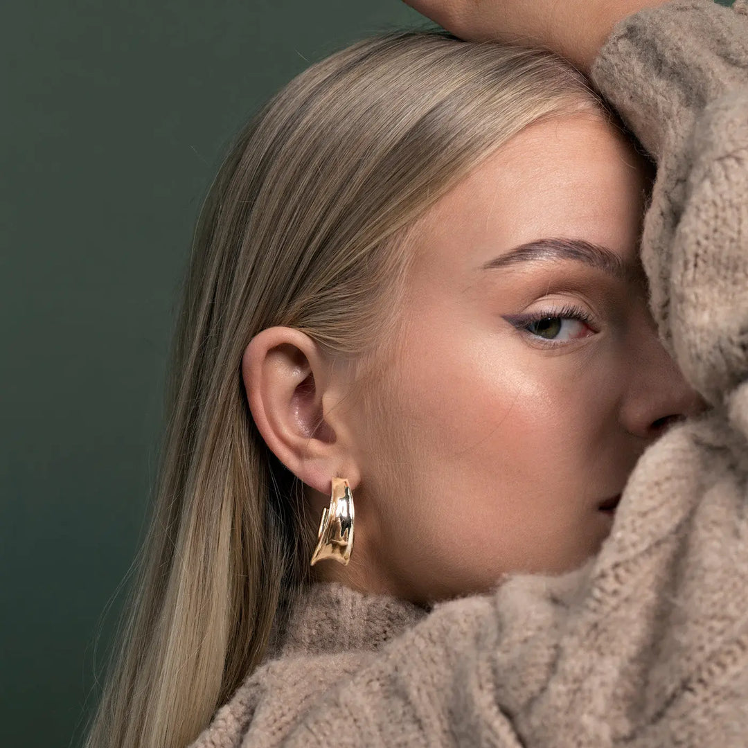 Large hammered hoop earrings Timi of Sweden